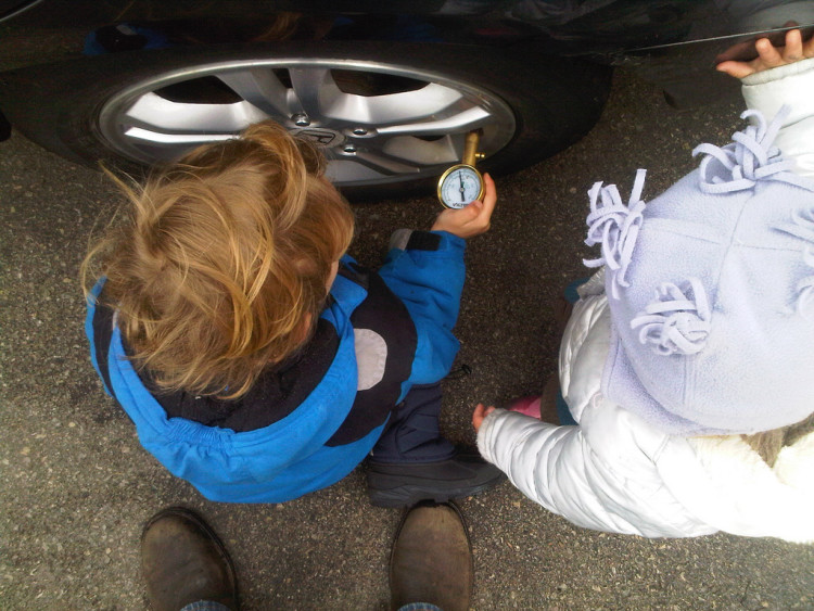 CC image Kids checking the tire pressure by notpierre on Flickr